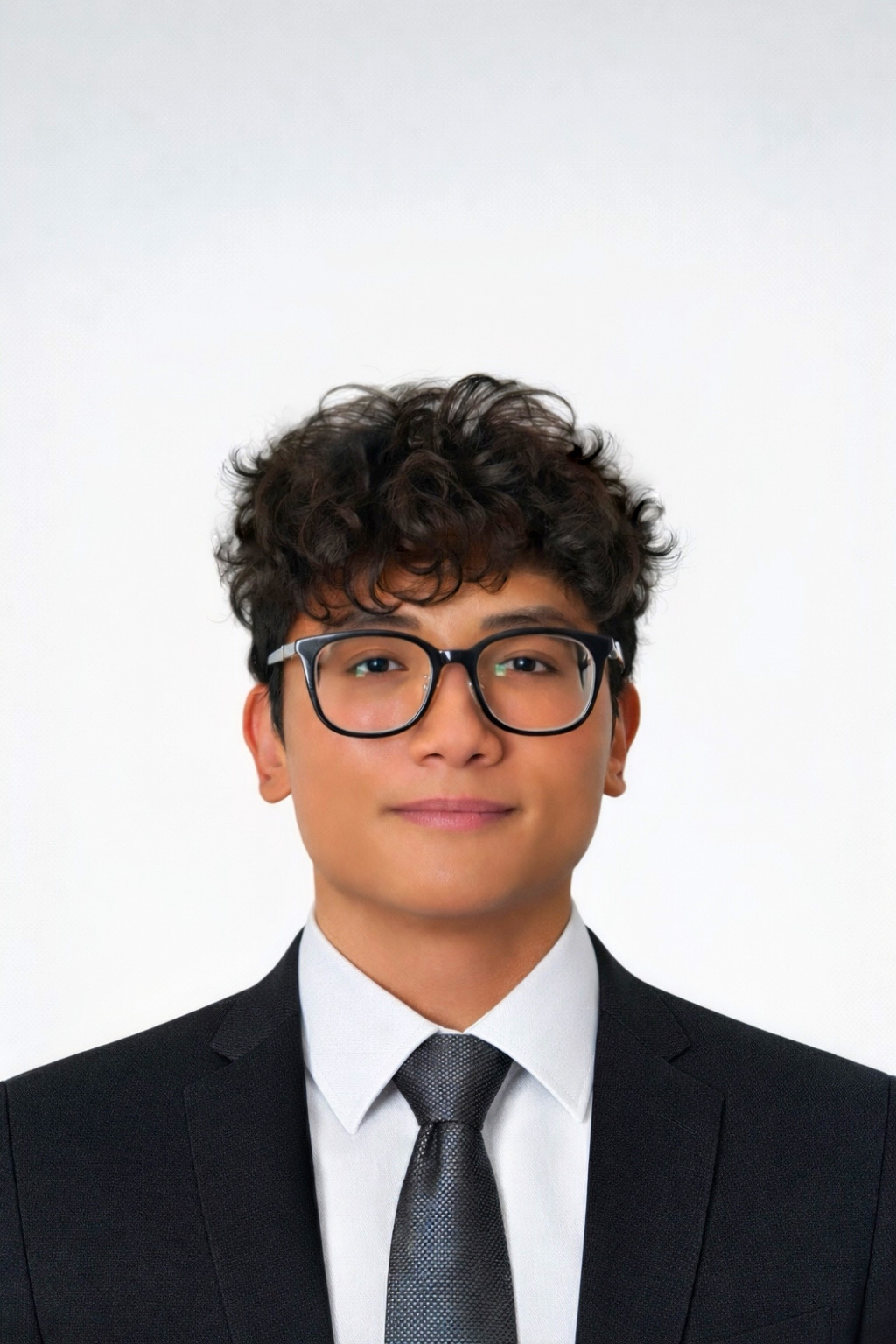 Studio headshot of Mark Jayson Farol in a dark blazer against a light background.